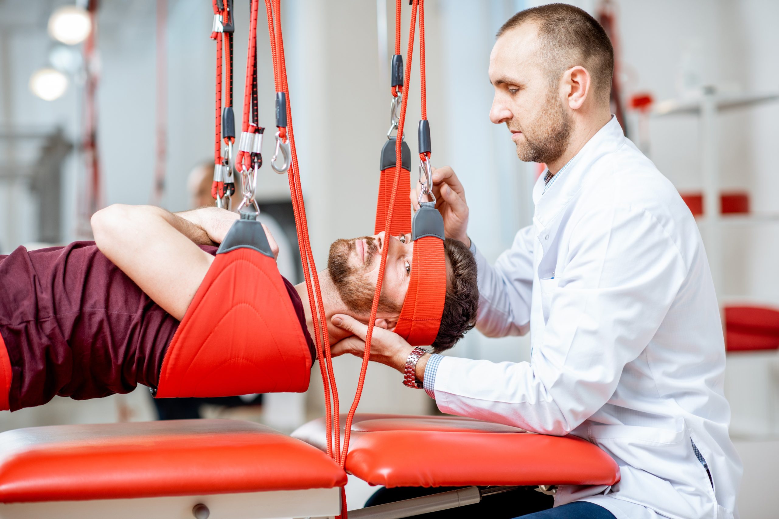 physiotherapist-doing-spine-treatment-with-suspens-2025-03-13-04-00-17-utc (1)